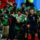Illustration for article titled Photographer Tackled By Celebrating Croatian Players Got Incredible Photos, Kisses